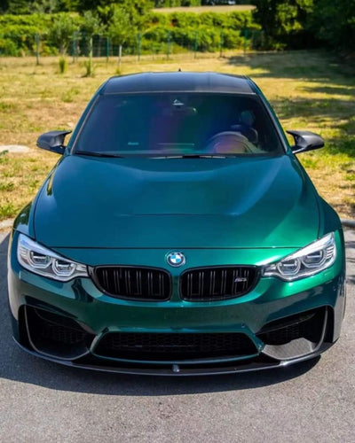 BMW sedan featuring Hunter Green vinyl wrap gloss