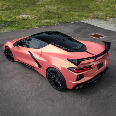 Corvette wrapped in TeckWrap Coral Peach RB08-HD gloss metallic vinyl parked on asphalt