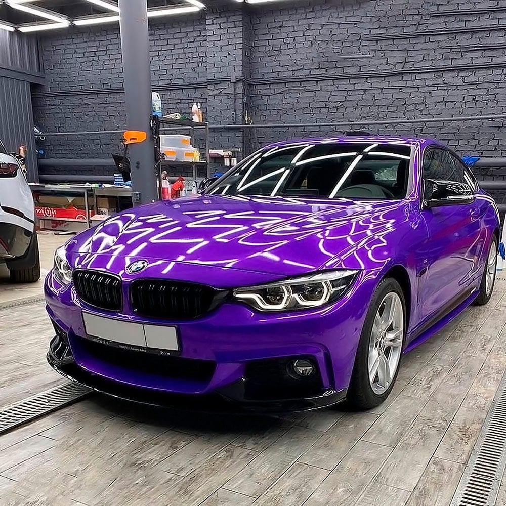BMW coupe wrapped in Midnight Purple Gloss Vinyl