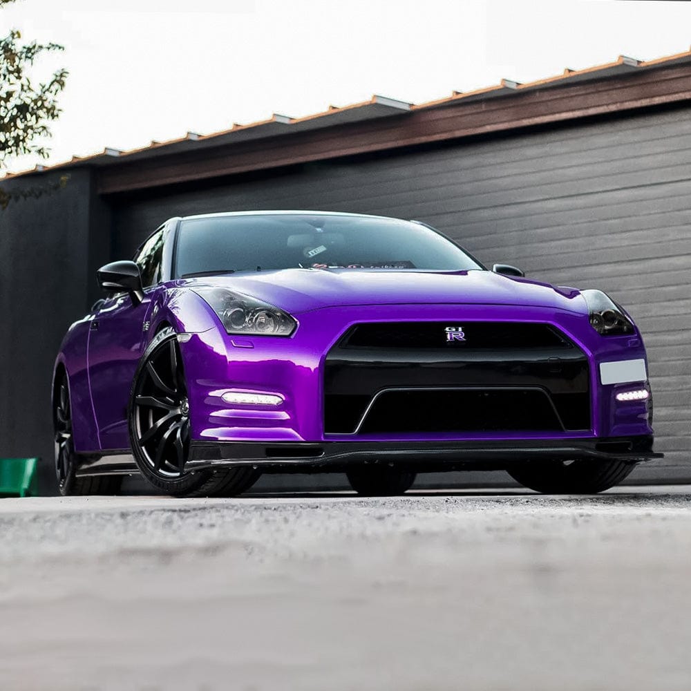 Front-angle view of Nissan GT-R wrapped with TeckWrap Midnight Purple (RB20-HD) Gloss Vinyl Wrap, emphasizing the rich, deep glossy purple finish.
