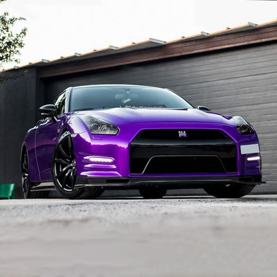 Front-angle view of Nissan GT-R wrapped with TeckWrap Midnight Purple (RB20-HD) Gloss Vinyl Wrap, emphasizing the rich, deep glossy purple finish.