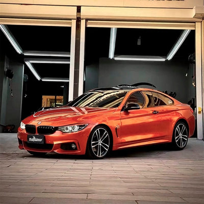 Luxury coupe wrapped with Glossy Paprika Orange Vinyl