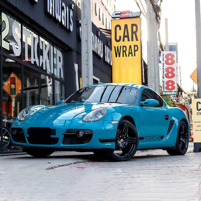 Porsche Cayman wrapped in Rolling Sea Gloss Vinyl