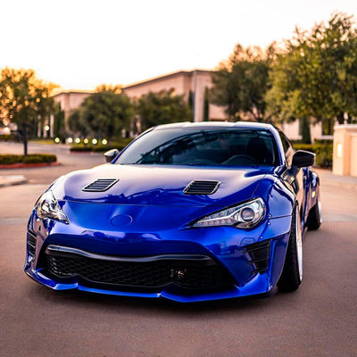 Sporty car wrapped with Royal Blue Gloss Vinyl