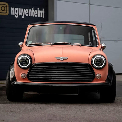Classic Mini Cooper beautifully wrapped in TeckWrap Autumn Blaze (SCM36) Matte Vinyl Wrap, highlighting a charming, retro-modern coral matte appearance.