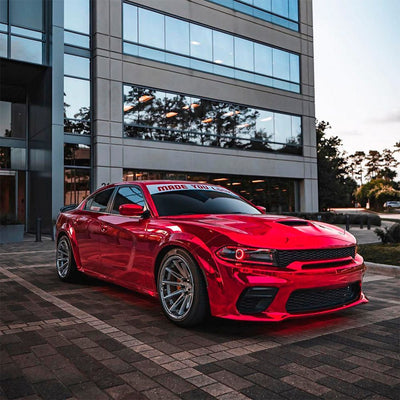 Side View of a Glossy Cherry Red Chrome Wrapped Car