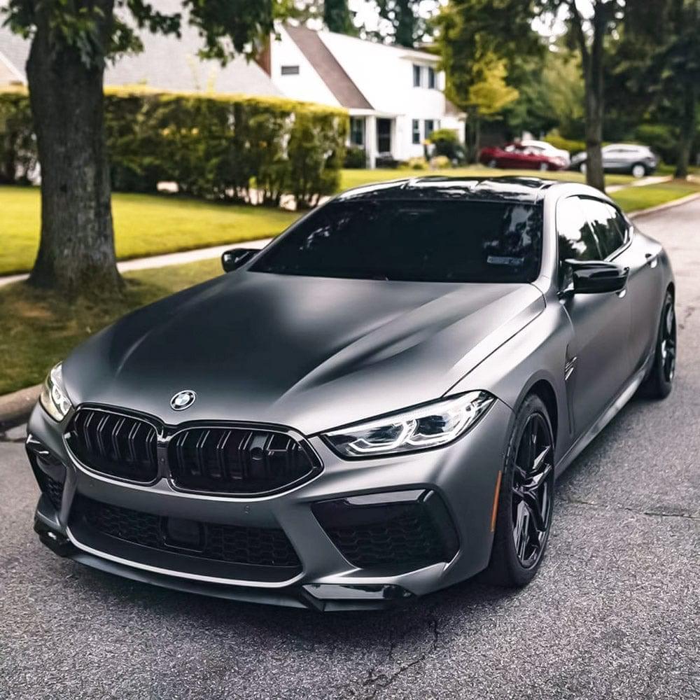 Front view of a sleek BMW wrapped in TeckWrap Satin Black Silver  Vinyl Wrap