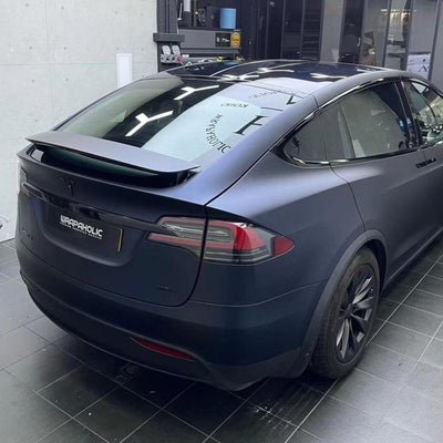 of Tesla car wrapped in premium TeckWrap Satin Boysenberry Black  vinyl