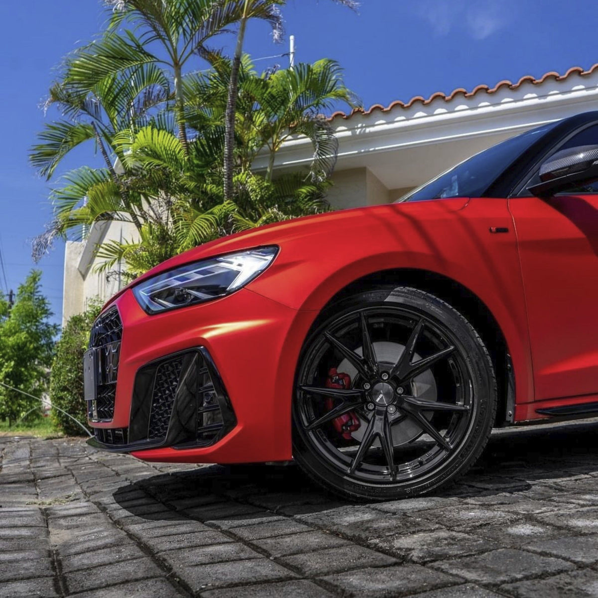 Front wheel wrapped in Flame Red satin vinyl wrap