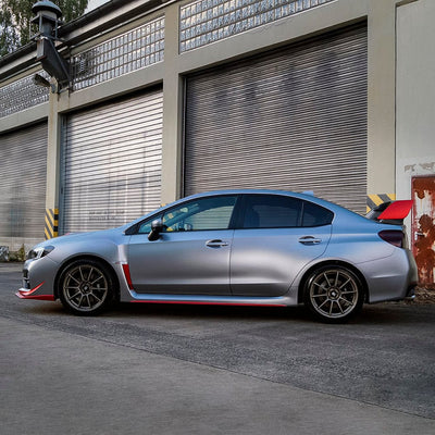 Side view of a Subaru sedan wrapped in Gunmetal Grey satin vinyl