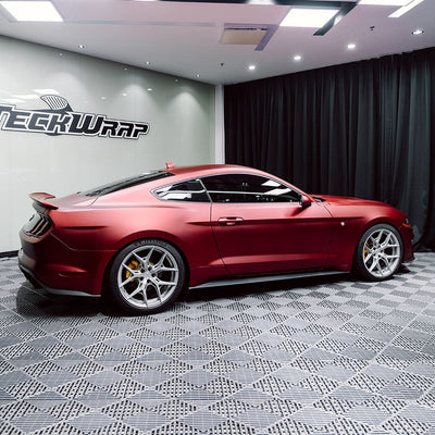 Side profile of a Ford Mustang in TeckWrap Satin Metallic Oxide Red (SMT18) vinyl wrap, highlighting the smooth matte texture and metallic shine.