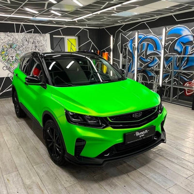 Front view of a car wrapped in Paradise Green Satin Vinyl