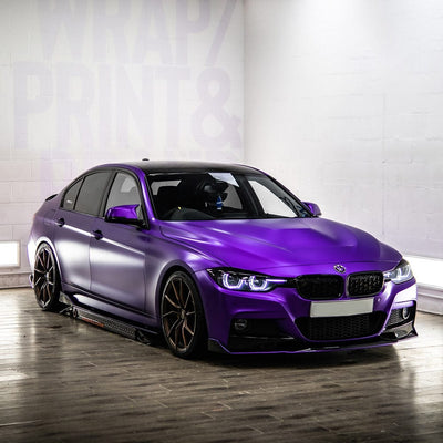 BMW wrapped in TeckWrap's Violet Purple (VCH416-S) Satin Vinyl Wrap, highlighting the sleek, luxurious matte finish under indoor lighting.
