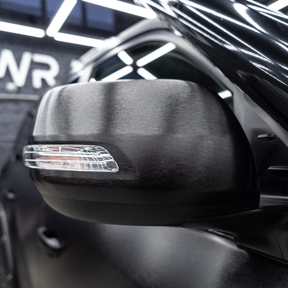 side mirror wrapped in Brushed Black structured vinyl