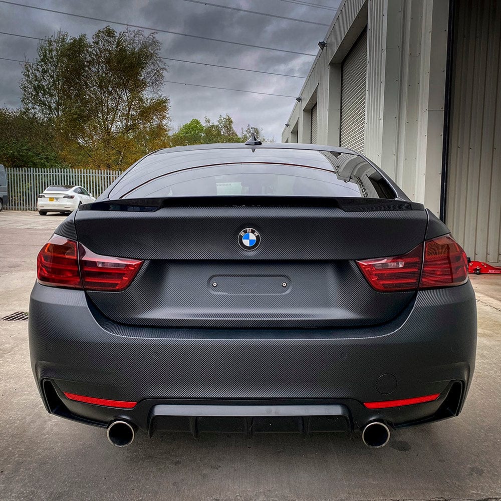 BMW trunk wrapped in Noir Black Carbon Vinyl Wrap